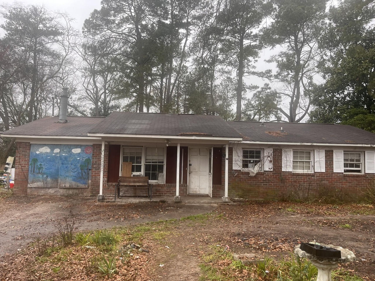 Before photo of residential exterior improvement project by Syntaris Group